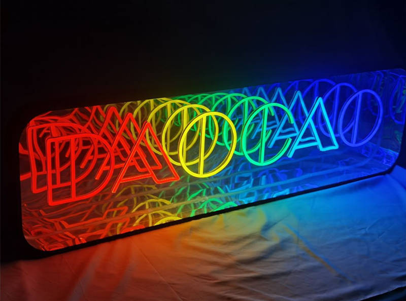 infinity mirror neon sign with rainbow color letters